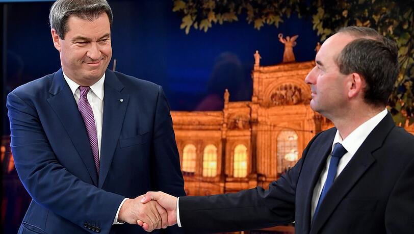Reichten sich schon am Sonntag vorsichtig die Hand: Ministerpräsident Markus Söder (CSU, links) Freie-Wähler-Chef Hubert Aiwanger (Archivbild). Reichten sich schon am Sonntag vorsichtig die Hand: Ministerpräsident Markus Söder (CSU, links) Freie-Wähler-Chef Hubert Aiwanger (Archivbild).