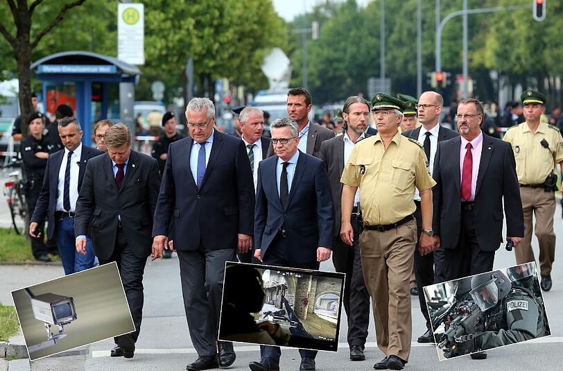 Bundesinnenminister Thomas de Maiziere (M.), Bayerns Innenminister Joachim Herrmann (l.) und Landespolizeipräsident Wilhelm Schmidbauer (r.) kamen am Tag nach dem Amoklauf zum Olympia-Einkaufszentrum in München. Foto: Karl-Josef Hildenbrand