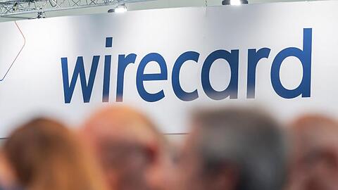 Ein Schild mit der Aufschrift "wirecard". Foto: Peter Kneffel/dpa