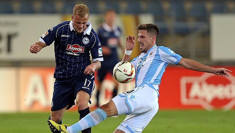 Hatte gegen Arminia Bielefeld (hier Christoph Hemlein) am Ende einen schweren Stand: Milos Degenek und der TSV 1860.