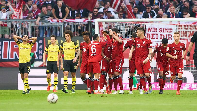 Die Bayern jubeln, die Dortmunder sind mehr als bedröppelt. Die Bayern jubeln, die Dortmunder sind mehr als bedröppelt.