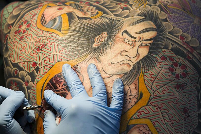 Tatoos können Kunst sein &ndash; wie in diesem Fall: eine Rückentätowierung, die bei einer Messe in Genf entstand.