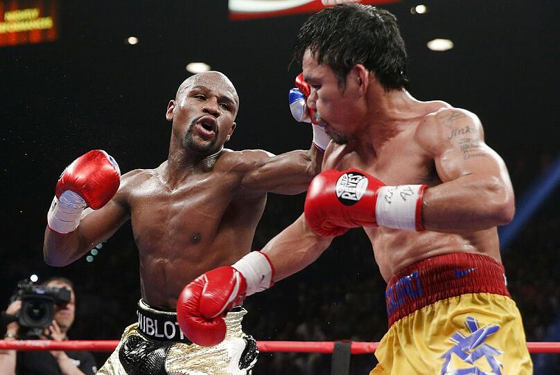 Floyd Mayweather hat den Angriff von Manny Pacquiao im Rekord-Boxkampf erfolgreich abgewehrt und bleibt auch in seinem 48. Profi-Duell ungeschlagen. Der Fight in Bildern.