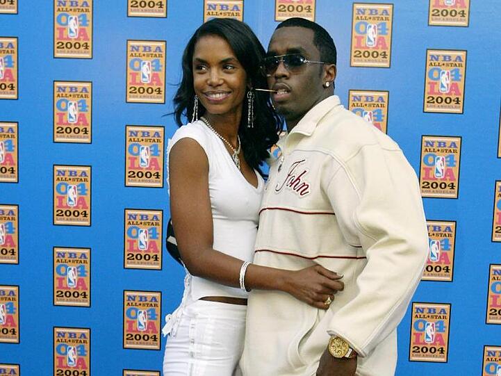 Das amerikanische Model Kim Porter (l) und der Musiker Sean "Diddy" Combs (2004).