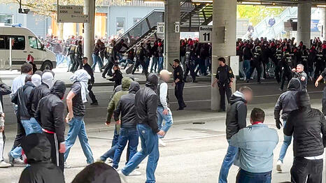 Polizisten gehen gegen vermummte, gewaltbereite Fans vor. Rivalisierende Fu&szlig;ballfans des VfB Stuttgart und des FC Bayern haben sich eine Massenschl&auml;gerei geliefert. Wie eine Sprecherin der Polizei best&auml;tigte, wurden dabei mehrere Menschen verletzt, darunter auch Polizisten.