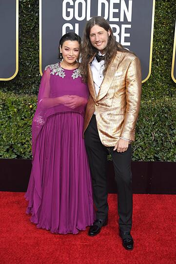 Flop: Ob die Violinistin Serena McKinney und der Komponist Ludwig Göransson wohl eigentlich auf eine Bad-Taste-Party wollten? Das könnte man bei der Outfit-Wahl zumindest vermuten.