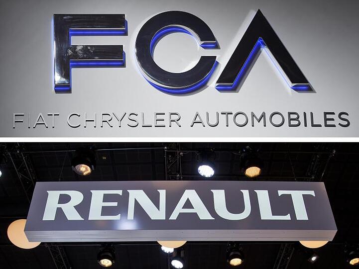 Die Firmenschriftzüge der Autokonzerne Fiat Chrysler und Renault.