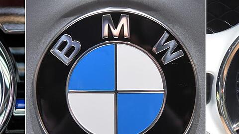 Die Logos der Automobilhersteller VW (l-r), BMW und Mercedes Benz (Kombo).