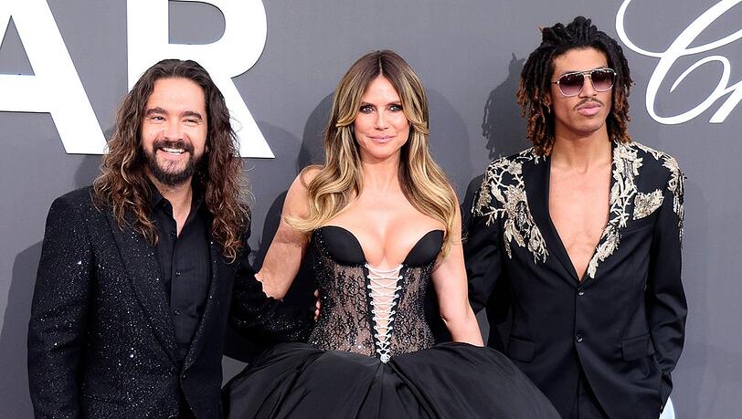 Tom Kaulitz (l.), Heidi Klum und Henry Samuel auf der amfAR-Gala in Cannes im Mai 2026. Tom Kaulitz (l.), Heidi Klum und Henry Samuel auf der amfAR-Gala in Cannes im Mai 2026.