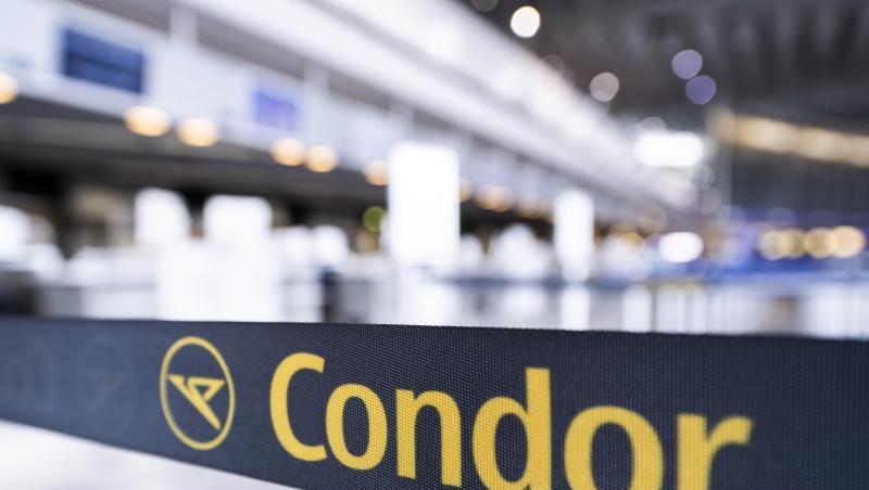 Das Condor-Logo auf einem Absperrband vor einem geschlossenen Schalter. Das Condor-Logo auf einem Absperrband vor einem geschlossenen Schalter.