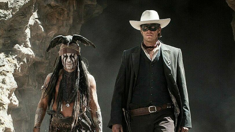 "Lone Ranger": Zusammen mit dem kauzigen Komantschen Tonto (Johnny Depp, l.) nimmt John Reid (Armie Hammer) Rache