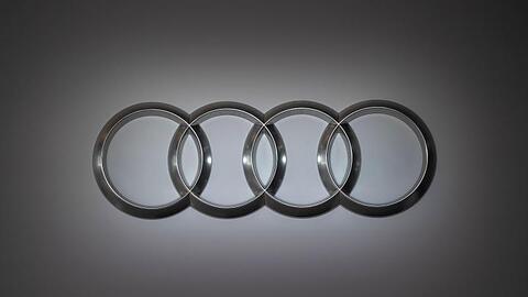 Ein Audi-Logo ist an einer Wand angebracht. Foto: Marijan Murat/Archivbild