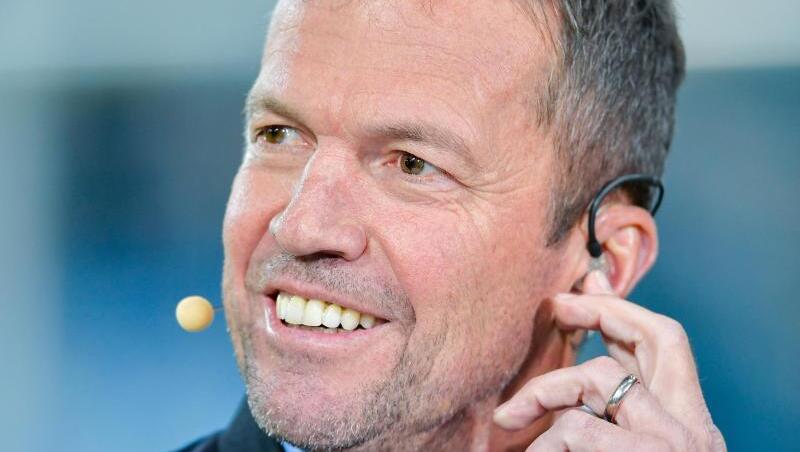 Der ehemalige Fussballer Lothar Matthäus lächelt. Foto: Uwe Anspach/dpa/Archivbild Der ehemalige Fussballer Lothar Matthäus lächelt. Foto: Uwe Anspach/dpa/Archivbild