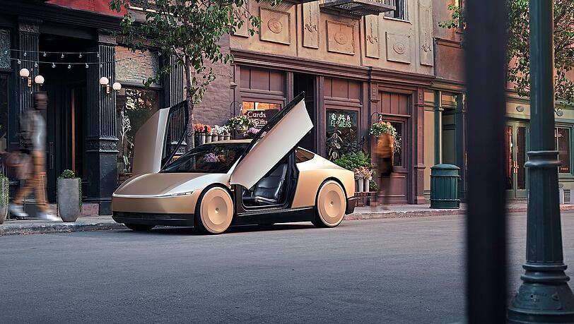 Auf dem animierten Bild ist der Tesla Robotaxi-Prototyp zu sehen. Trotz ambitionierter Projekte hat der Chef des US-Unternehmens Elon Musk Schwierigkeiten, sich auf dem europäischen Kfz-Markt durchzusetzen.