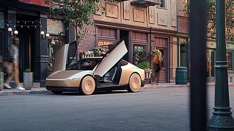 Auf dem animierten Bild ist der Tesla Robotaxi-Prototyp zu sehen. Trotz ambitionierter Projekte hat der Chef des US-Unternehmens Elon Musk Schwierigkeiten, sich auf dem europäischen Kfz-Markt durchzusetzen.