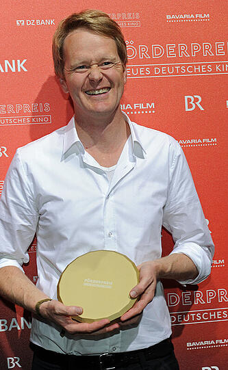 Der Regisseur Ralf Westhoff wird am 04.07.2014 im Rahmen des Filmfest München mit dem Förderpreis Neues Deutsches Kino in der Kategorie "Regie" für seinen Film "Wir sind die Neuen" geehrt. Foto: Ursula Düren/dpa