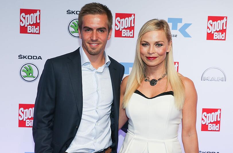 WM-Kapitän Philipp Lahm und die Boxerin Regina Hallmich.