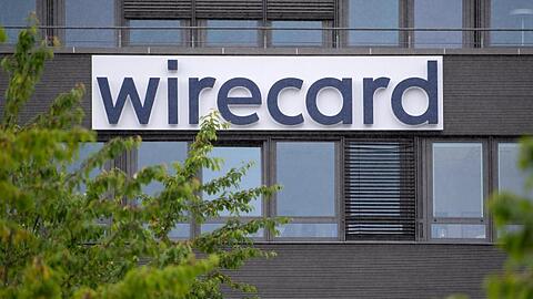 Der Schriftzug von Wirecard ist an der Firmenzentrale zu sehen. Foto: Sven Hoppe/dpa