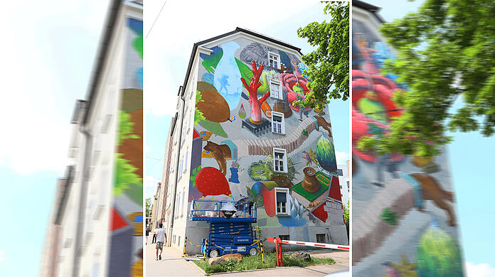 Noch ist das Wandgemälde an der Dachauer Straße in Arbeit.