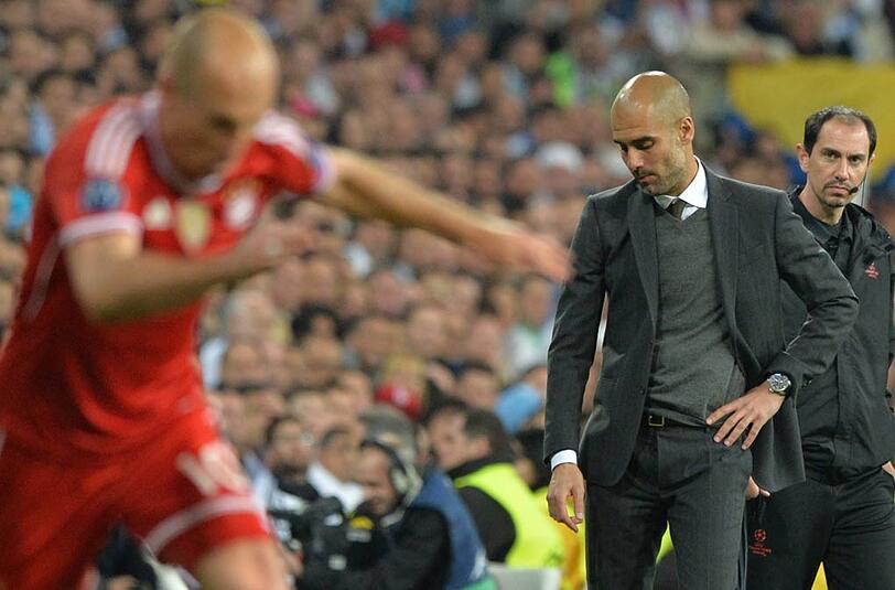 Arjen Robben (l.) und Pep Guardiola - auch sie haben noch Zuversicht nach der 0:1-Niederlage im Hinspiel des Champions-League-Halbfinales bei Real Madrid.