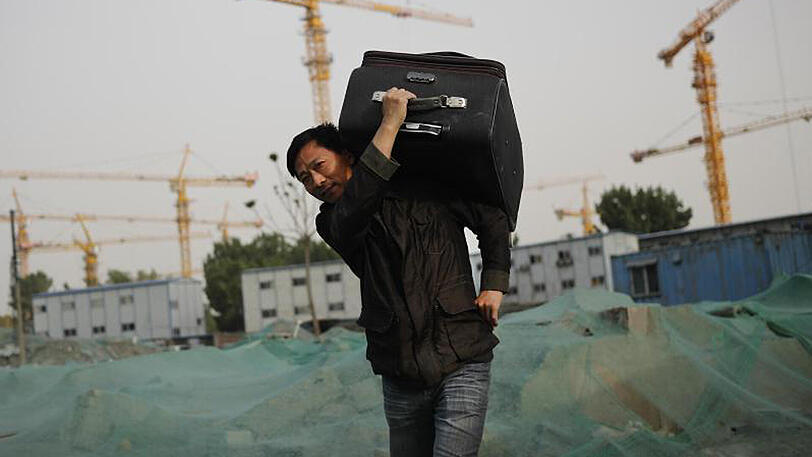 Ein Wanderarbeiter auf einer Baustelle in Peking. Die US-Ratingagentur Moody's hat China zum ersten Mal seit 1989 abgestuft.