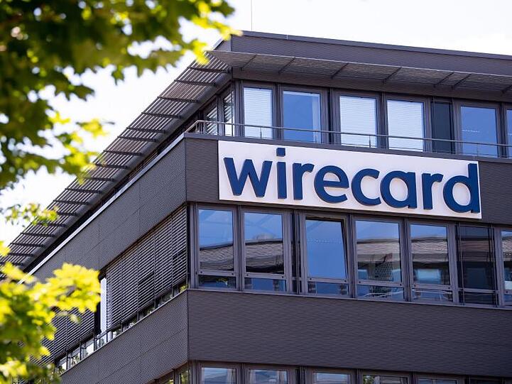Der Schriftzug von Wirecard ist an der Firmenzentrale zu sehen. Foto: Sven Hoppe/dpa/Symbolbild