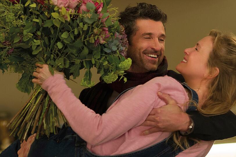 Die erschlankte Bridget (Renée Zellweger) auf dem Arm von Jack (Patrick Dempsey).