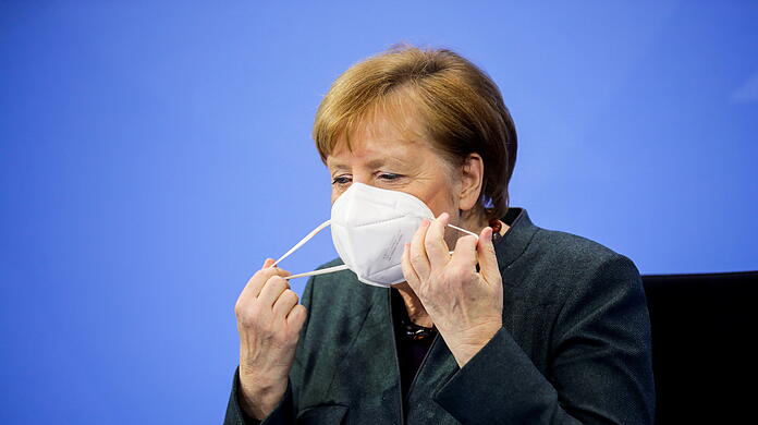 Maske runter: Bundeskanzlerin Angela Merkel (CDU) vor der Verkündung der am 19. Januar gefassten Corona-Beschlüsse.