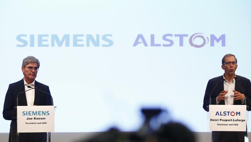 Alstom-CEO Henri Poupart-Lafarge (r), und der Vorstandsvorsitzende von Siemens, Joe Kaeser, sprechen. Foto: Thibault Camus/AP/Archiv Alstom-CEO Henri Poupart-Lafarge (r), und der Vorstandsvorsitzende von Siemens, Joe Kaeser, sprechen. Foto: Thibault Camus/AP/Archiv