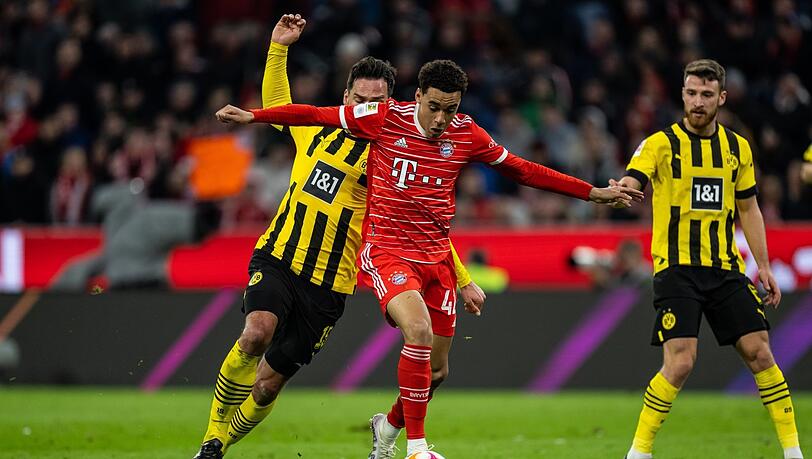Zweikampf um die Meisterschaft: Der FC Bayern um Kingsley Coman und die Borussia aus Dortmund. Zweikampf um die Meisterschaft: Der FC Bayern um Kingsley Coman und die Borussia aus Dortmund.
