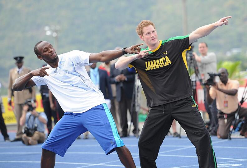 Prinz Harry und Usain Bolt.