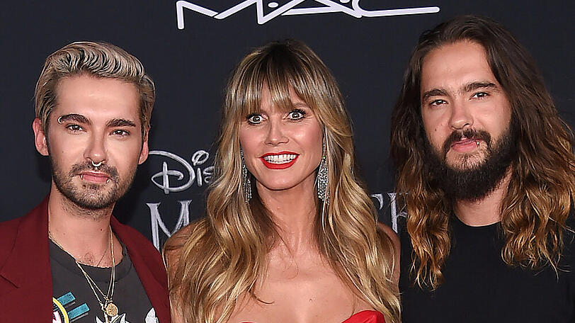 Gemeinsam auf dem roten Teppich: Heidi Klum mit Ehemann Tom Kaulitz (r.) und dessen Zwillingsbruder Bill Kaulitz bei einer Veranstaltung