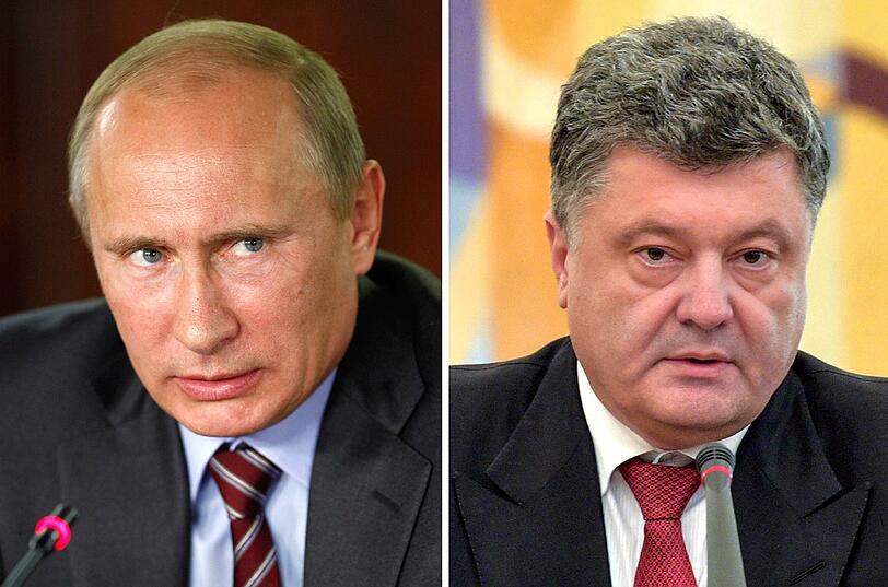 Der ukrainische Präsident Petro Poroschenko (r.) ordnete am Samstag an, die Finanzierung von Staatsbetrieben und Behörden in dem Bürgerkriegsgebiet zu stoppen sowie Mitarbeiter in andere Landesteile zu verlegen. Kremlchef Wladimir Putin ist empört.