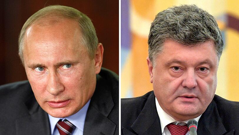 Der ukrainische Präsident Petro Poroschenko (r.) ordnete am Samstag an, die Finanzierung von Staatsbetrieben und Behörden in dem Bürgerkriegsgebiet zu stoppen sowie Mitarbeiter in andere Landesteile zu verlegen. Kremlchef Wladimir Putin ist empört. Der ukrainische Präsident Petro Poroschenko (r.) ordnete am Samstag an, die Finanzierung von Staatsbetrieben und Behörden in dem Bürgerkriegsgebiet zu stoppen sowie Mitarbeiter in andere Landesteile zu verlegen. Kremlchef Wladimir Putin ist empört.