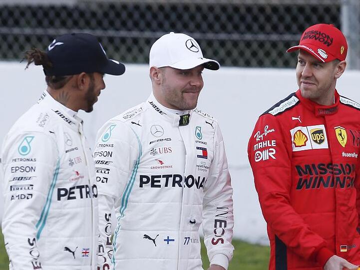 Die Stars der Formel 1: Die Mercedes-Fahrer Lewis Hamilton (l) und Valtteri Bottas (M) sowie Ferarri-Pilot Sebastian Vettel.