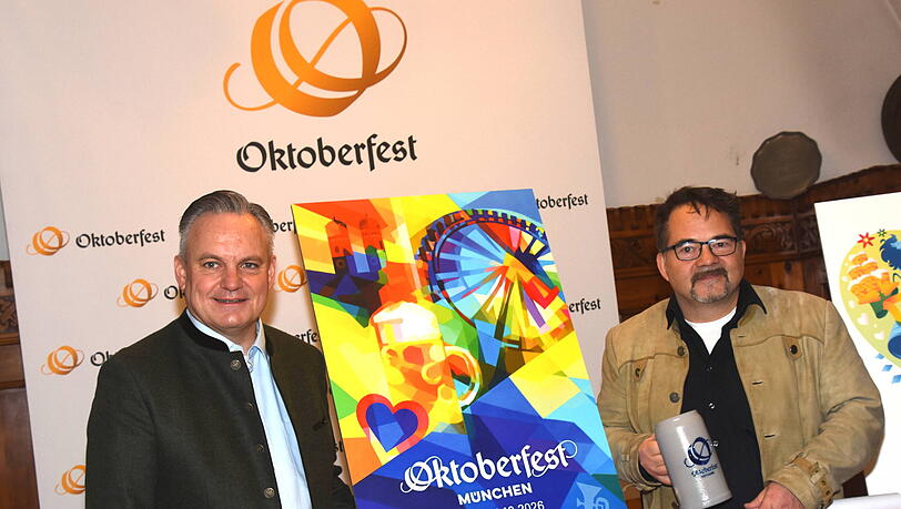 Wiesn-Chef Christian Scharpf (SPD) hat am Freitag, 6.2. das diesj&auml;hrige Wiesnplakat enth&uuml;llt. Gewinner ist der Grafiker Florian Huber (r.).