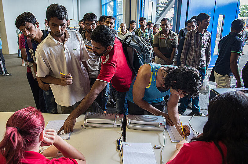Flüchtlinge bei ihrer Registrierung.
