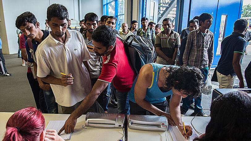 Flüchtlinge bei ihrer Registrierung. Flüchtlinge bei ihrer Registrierung.