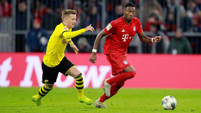 Kein Vorbeikommen: David Alaba fängt Marco Reus ab.