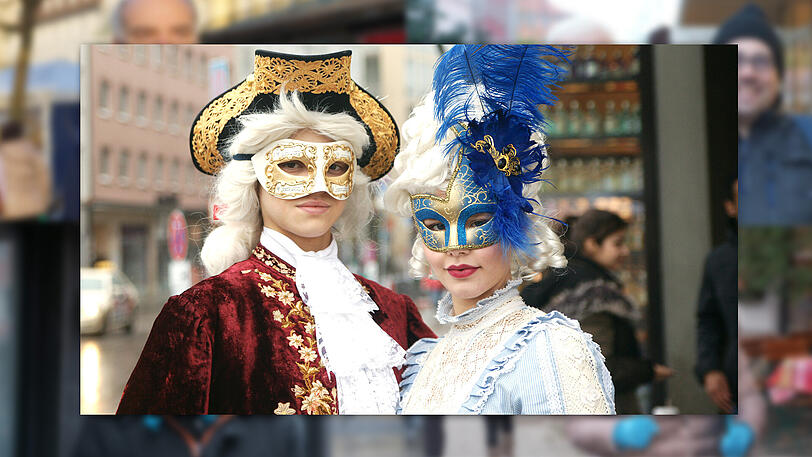 Von links die Schülerinnen Anabella (18) als Wolfgang Amadeus Mozart und Annelie (17) als 
Mozarts Geliebte und spätere Ehefrau Constanze.
Anabella: "Bereits vor elf Jahren war ich das erste Mal als Mozart verkleidet auf dem Viktualienmarkt - so
auch heuer. Wir sind beide seit dem sechsten Lebensjahr im Münchner Domchor - und es fühlt sich edel an,
so ein schönes Gewand zum Fasching zu tragen.
Ich mag die Leichtigkeit vom Mozart und dass er eigentlich ein Frecher war. Es schweben immer noch viele Geheimnisse
rund um den Wolfgang Amadeus Mozart. Man weiß auch nicht, ob er seine Stücke alle selbst geschrieben hat. Ich glaube,
man hat früher gerne einiges vertuscht."
Annelie: "Ich fühle mich in diesem Outfit ein bißchen wie ein Schmuckstück. Mir macht es Spaß, etwas zu schauspielern. 
Ich habe im Stimmbildungsunterricht schon einige Stücke von Mozart gesungen. Besonders gerne mag ich die erste Arie von Die
Königin in der Nacht von der Zauberflöte.
Außerdem sitze ich total gerne im barokken Café Mozart in der Pettenkoferstraße und esse dort eine Schwarzwälder Kirschtorte.
Wunderbar indisch essen kann man im Garam Masala am Radlsteg. Das Gericht Alu Chana mit Kichererbsen und Kartoffeln, Zwiebeln,
Tomaten und Ingwer in scharfer Currysauce ist für mich eine herrliche Geschmacksexplosion."