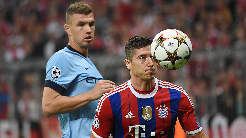 Bald im gleichen Trikot auf dem Feld? Edin Dzeko (hinten), hier noch im Dress von Manchester City, und Robert Lewandowski.
