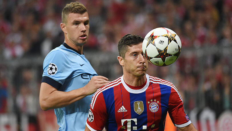 Bald im gleichen Trikot auf dem Feld? Edin Dzeko (hinten), hier noch im Dress von Manchester City, und Robert Lewandowski. Bald im gleichen Trikot auf dem Feld? Edin Dzeko (hinten), hier noch im Dress von Manchester City, und Robert Lewandowski.