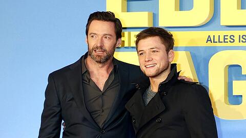 Hugh Jackman (l.) und Taron Egerton bei einer Vorführung von "Eddie the Eagle" im Jahr 2016 in München.