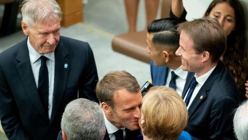Angela Merkel wird am Rande des UN-Klimagipfels von Emmanuel Macron und Harrison Ford (l) begrüßt. Angela Merkel wird am Rande des UN-Klimagipfels von Emmanuel Macron und Harrison Ford (l) begrüßt.