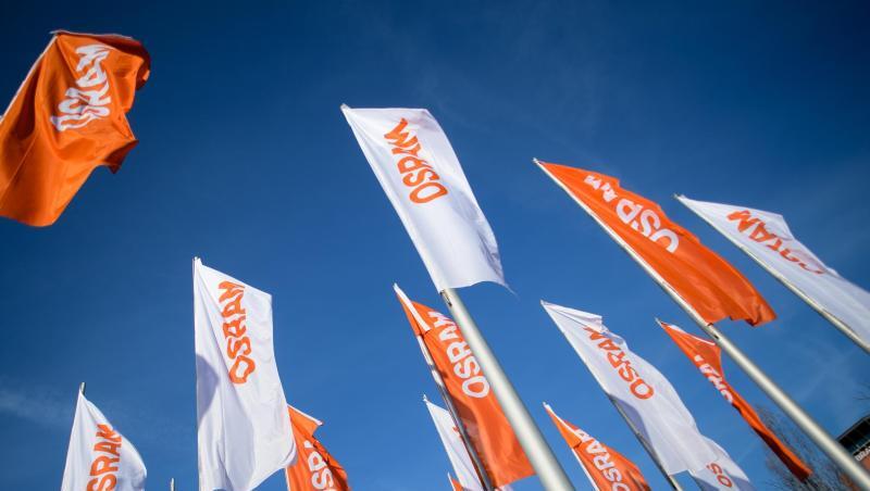 Flaggen mit dem Logo von Osram wehen im Wind. Foto: Matthias Balk/Archiv Flaggen mit dem Logo von Osram wehen im Wind. Foto: Matthias Balk/Archiv