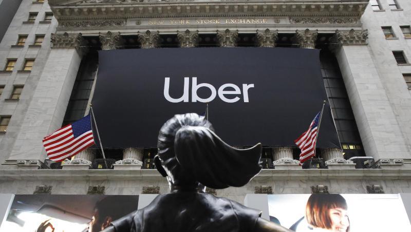 Uber-Banner vor der New Yorker Börse. Der Fahrdienstleister hofft auf reges Interesse der Anleger. Uber-Banner vor der New Yorker Börse. Der Fahrdienstleister hofft auf reges Interesse der Anleger.