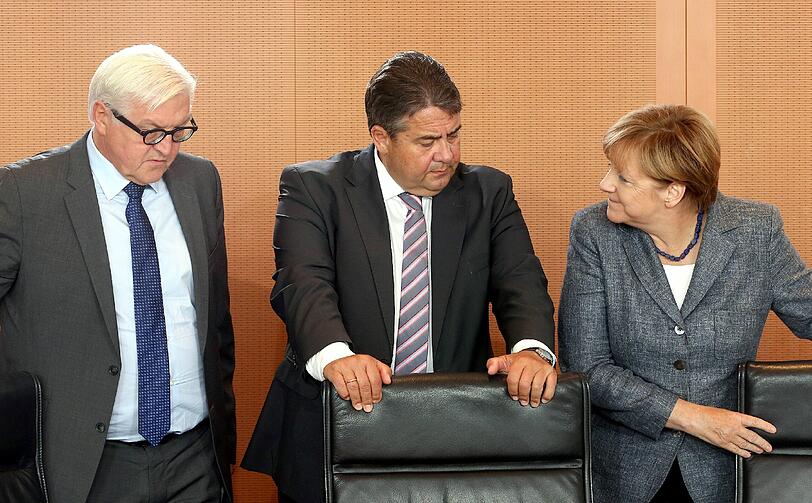 Angela Merkel mit Vizekanzler Sigmar Gabriel und Außenminister Frank-Walter Steinmeier.