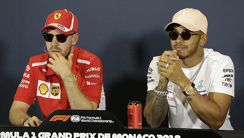 Pokerface vor dem Aufeinandertreffen in Monaco: Sebastian Vettel (l.) und Lewis Hamilton. Pokerface vor dem Aufeinandertreffen in Monaco: Sebastian Vettel (l.) und Lewis Hamilton.