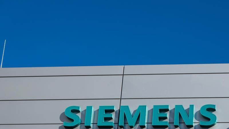 Logo und Schriftzug von Siemens Healthineers an einem Gebäude. Foto: Daniel Karmann/Archivbild Logo und Schriftzug von Siemens Healthineers an einem Gebäude. Foto: Daniel Karmann/Archivbild