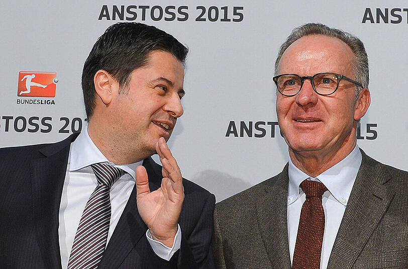 Christian Seifert, Vorsitzender der DFL-Geschäftsführung, Christian Seifert, Vorsitzender der DFL-Geschäftsführung spricht beim DFL-Neujahrsempfang in Frankfurt/Main mit Karl-Heinz Rummenigge, dem Vorstandsvorsitzenden der FC Bayern AG.